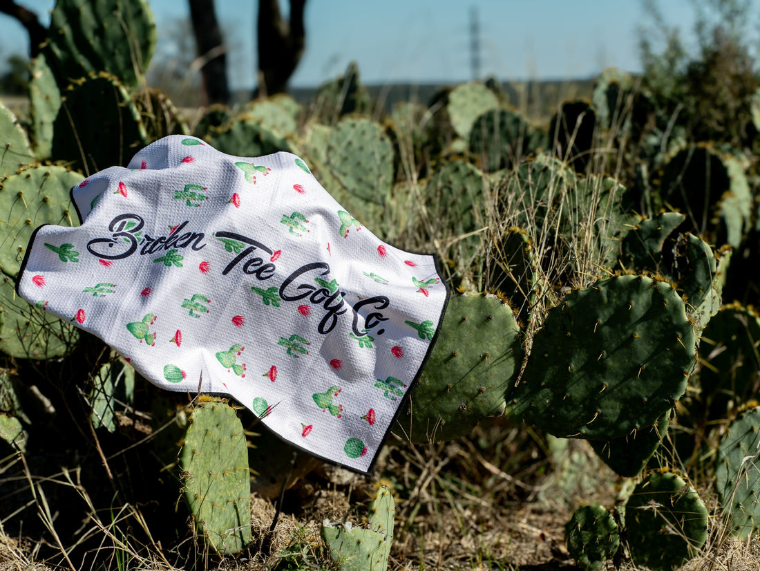 Golf towel with 'Broken Tee Golf Co' branding on cacti